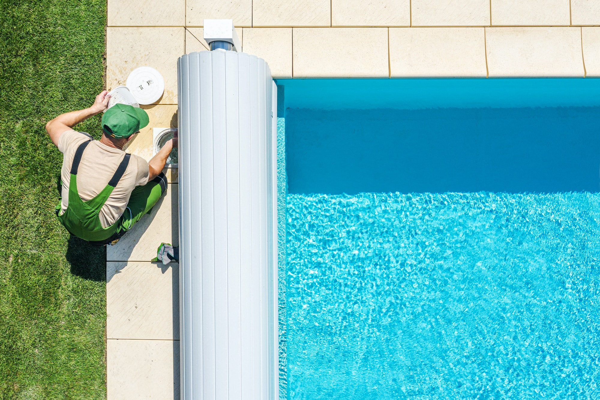 outdoor-swimming-pool-skimmer-filter-cleaning-aerial-view.jpg